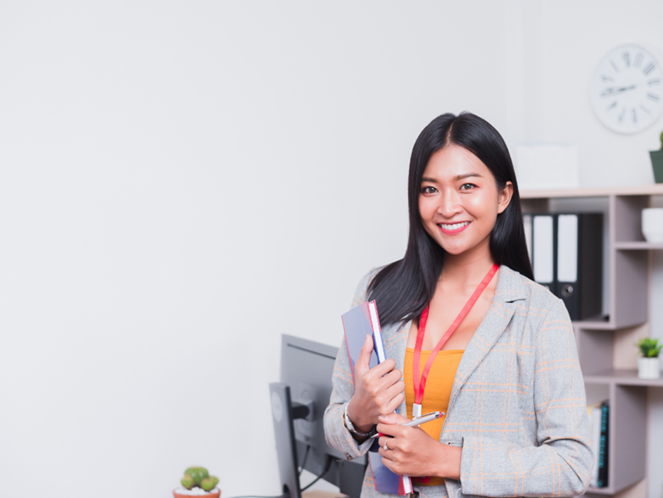 A friendly advisor standing in an office.