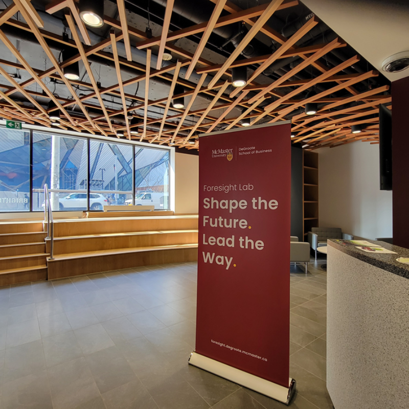 Foresight Lab Banner in the Lobby of McMaster Toronto Campus at 180 Bloor Street West, Displaying "Shape the Future. Lead the Way."
